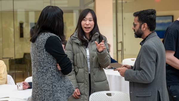 Analytics Without Borders attendees chat during break.